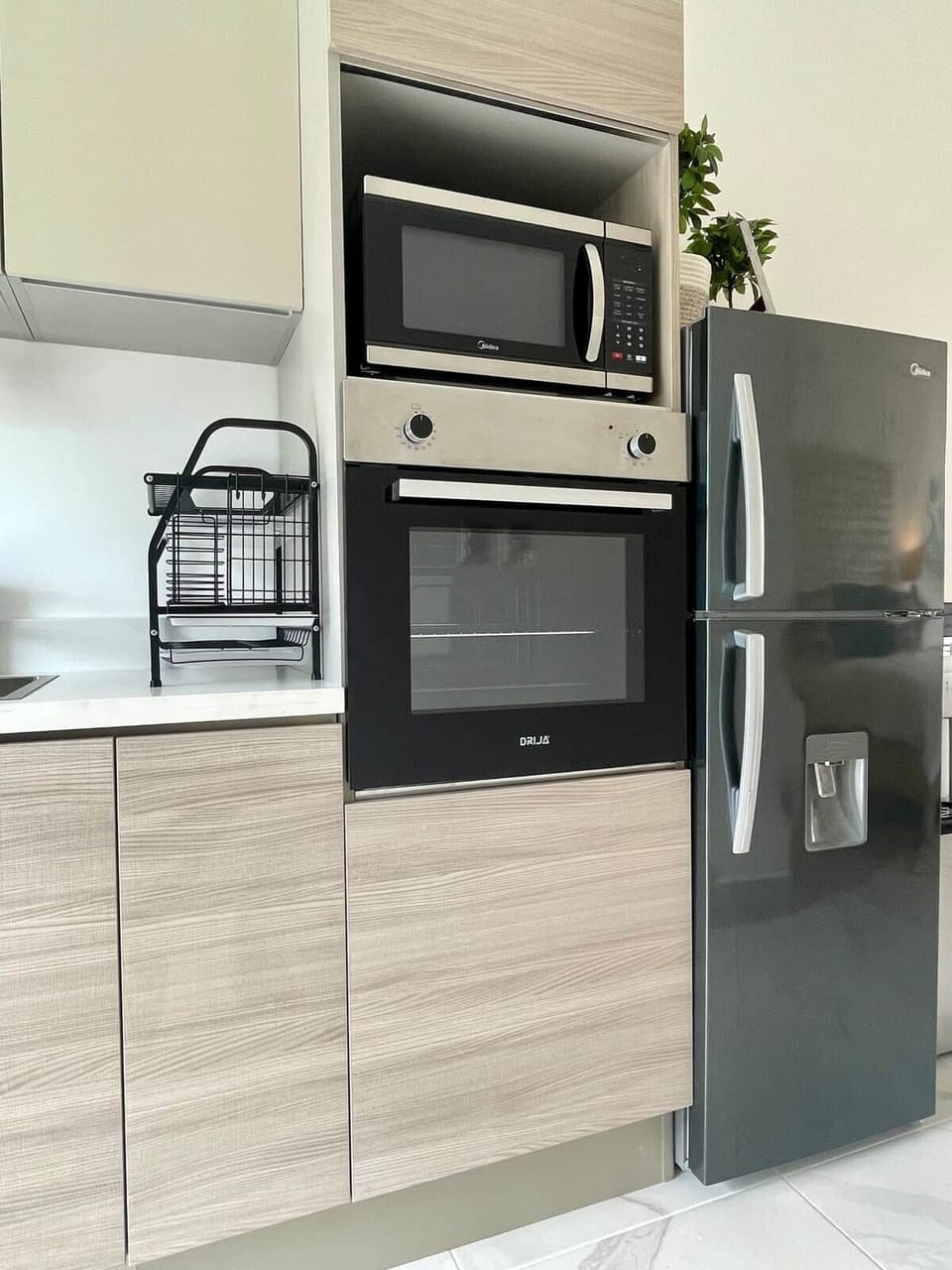 Fully equipped kitchen with five-burner stove, oven and microwave. 