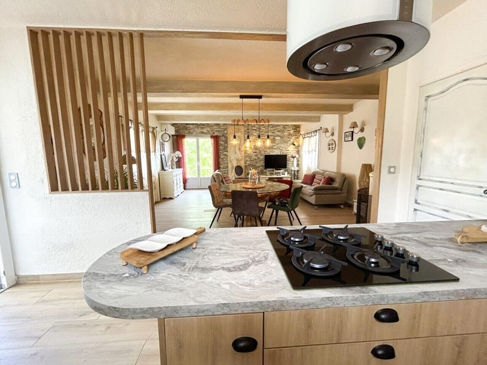 open-plan kitchen leading into the living room and dining room