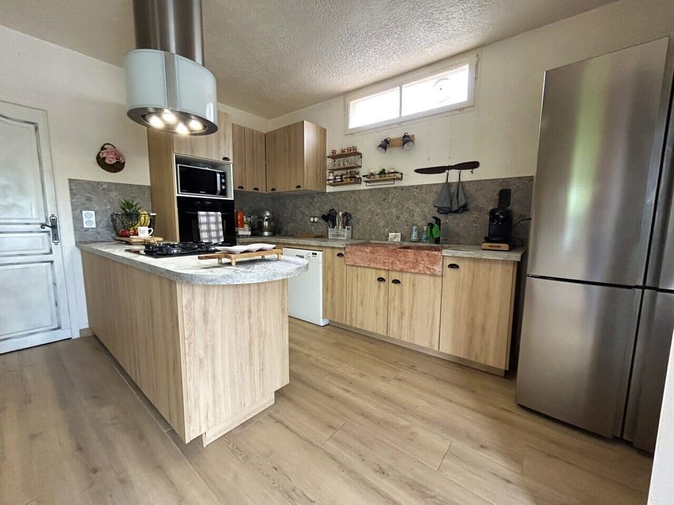 open-plan kitchen leading into the living room and dining room