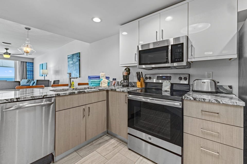This kitchen offers everything you need, from cooking essentials to sleek appliances, enhancing your vacation dining.