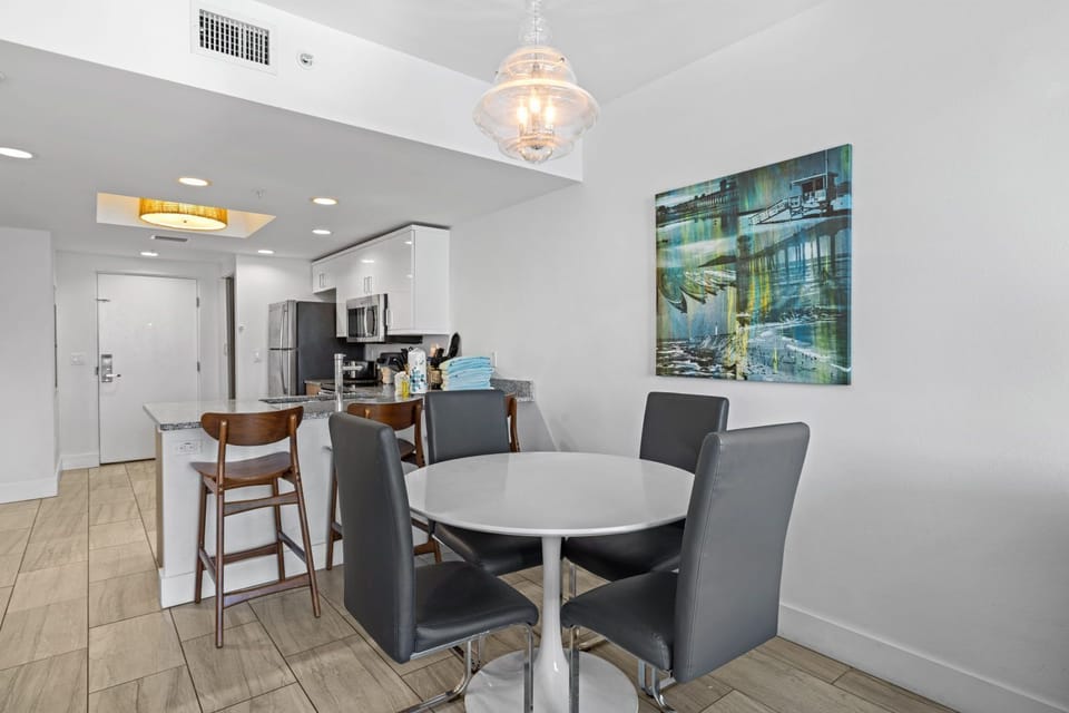 Gather around the sleek dining table, perfect for shared meals and cherished moments.
