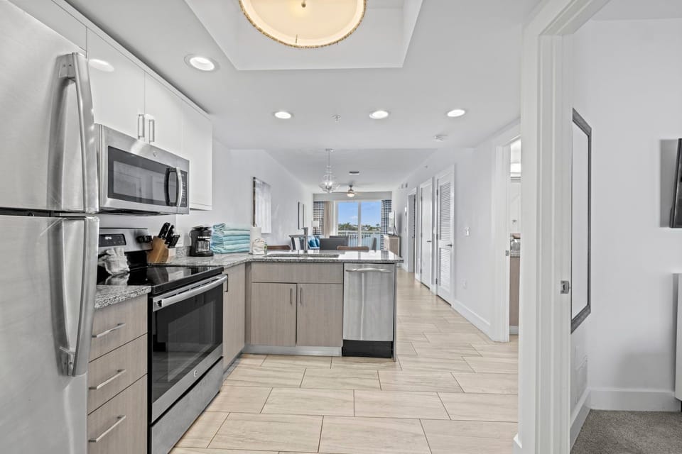 Plenty of workspace flows seamlessly into the kitchen, perfect for prep and enjoying views.