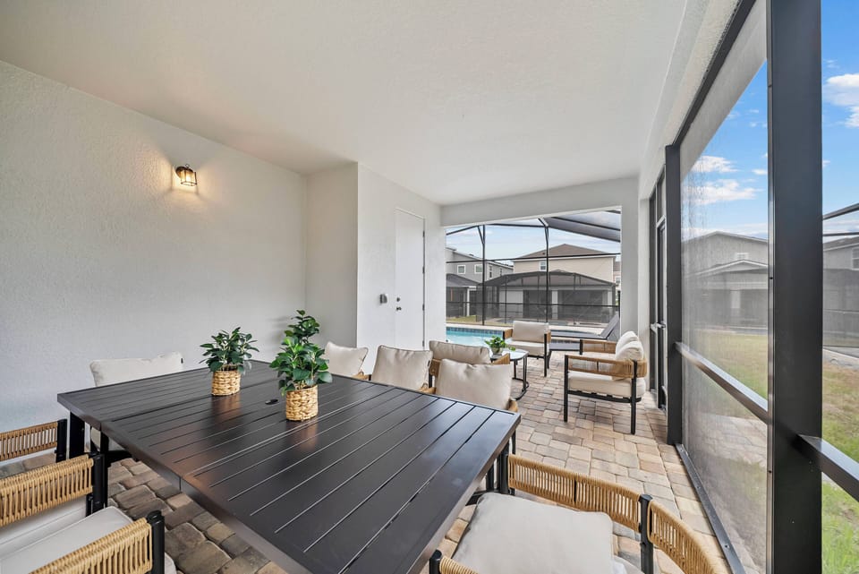 Step outside to your serene oasis with a sparkling screened pool, ideal for sunny afternoons. Experience the perfect blend of indoor and outdoor living, offering plenty of space for relaxation and entertaining.