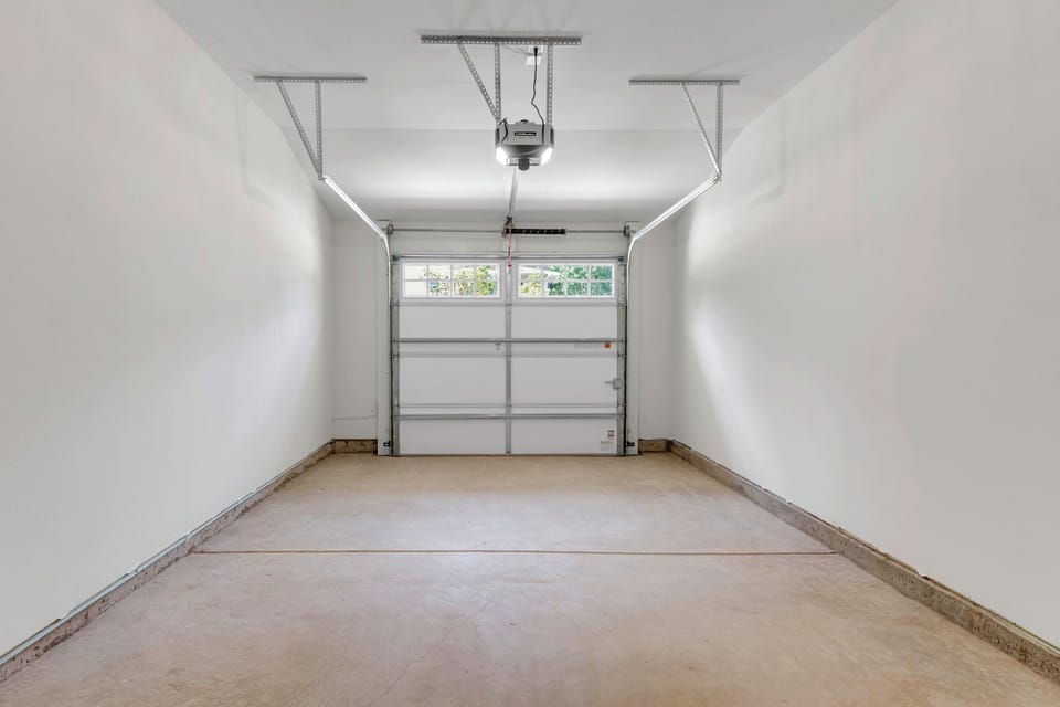 Single car garage with space for another car in the driveway