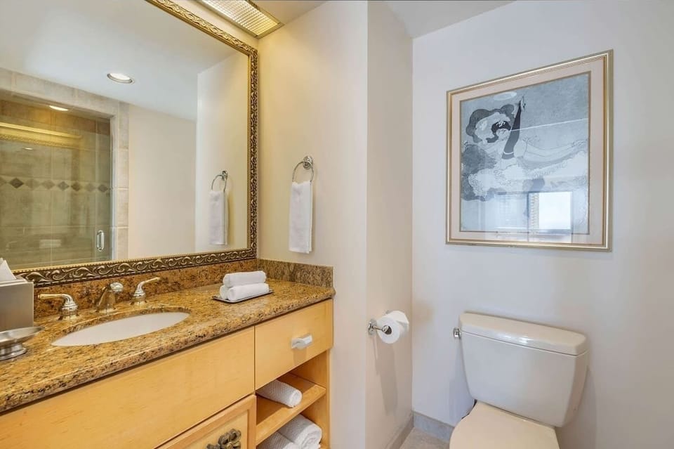 Refresh each morning with a spacious vanity and bright mirror.