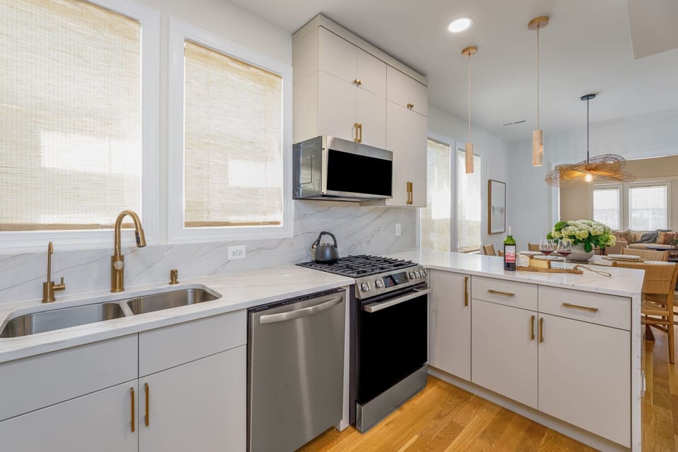 No expense was spared in here. We installed luxury gold hardware, a whisper-quiet Bosch dishwasher, and a built-in filtered water tap right at the sink.