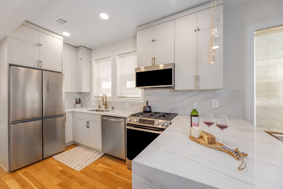 Step into our fully upgraded kitchen! You have a huge quartz peninsula to prep food, top-tier Moen hardware, and sleek stainless steel appliances.