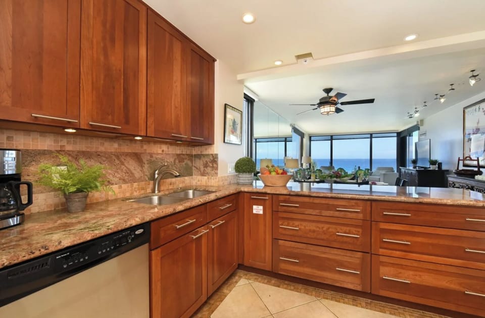 Unit 1: Cook with ease in this airy kitchen that opens into the living area, all while enjoying beautiful ocean views.