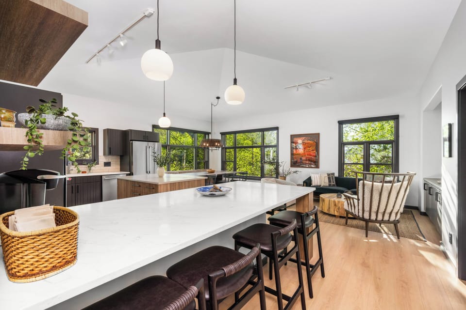 Two kitchen islands with bar seating for 6 total.