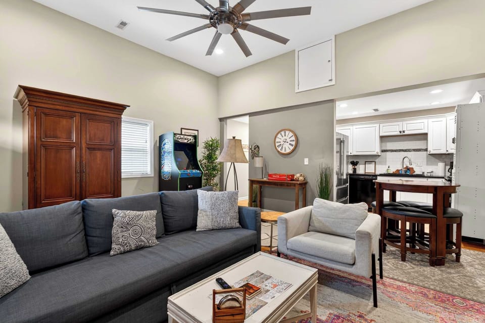 Living Room: Spacious living area with cozy furnishings, natural light, and modern touches. A comfortable space to unwind, socialize, or enjoy a movie night.