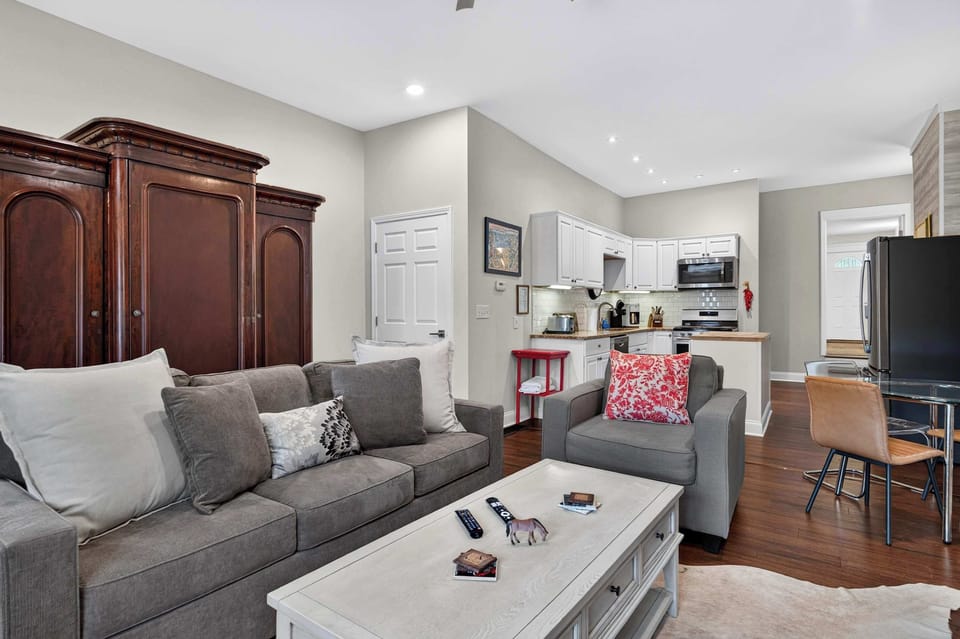 Living Room: Relax in this bright and inviting living room featuring comfortable seating, stylish décor, and plenty of natural light. The perfect place to unwind after a day of exploring.