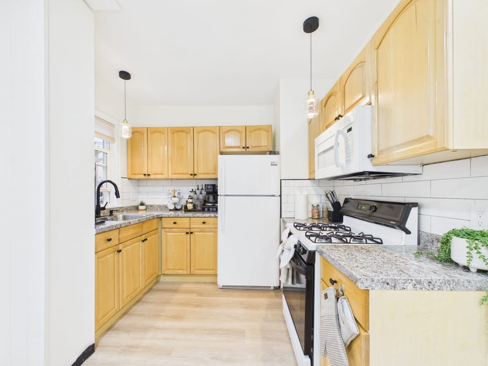 Bright kitchen with warm wood cabinets and ample prep space