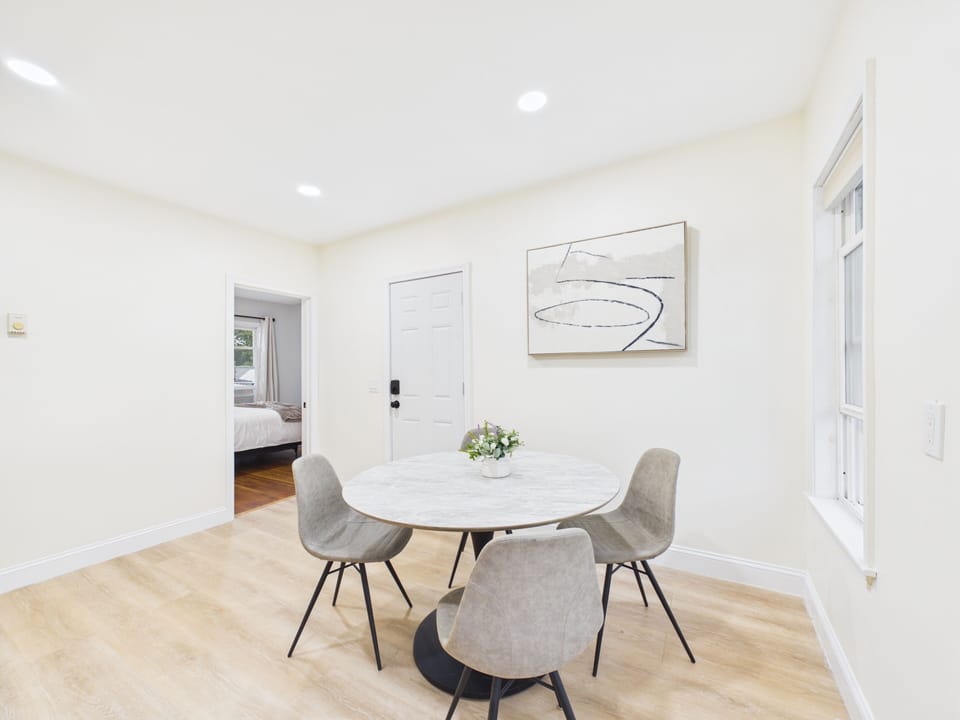 Bright, modern dining nook with seating for four and an airy feel