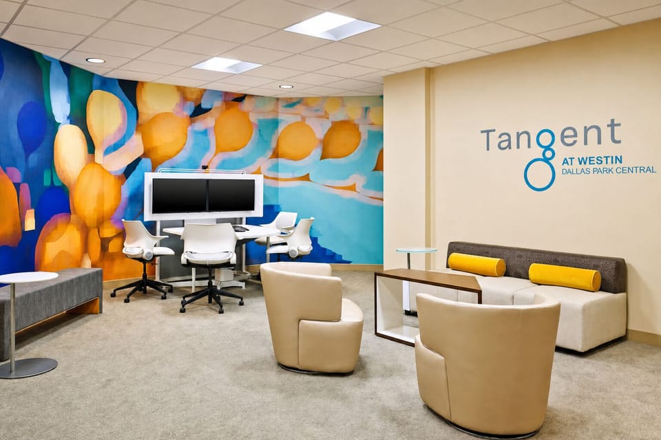 Connect and collaborate comfortably in a colorful, casual work lounge.