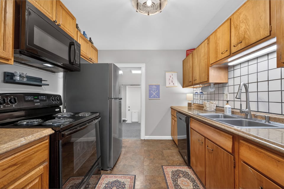 Your fully-equipped galley kitchen features modern appliances and ample counter space, making meal prep a breeze during your stay.