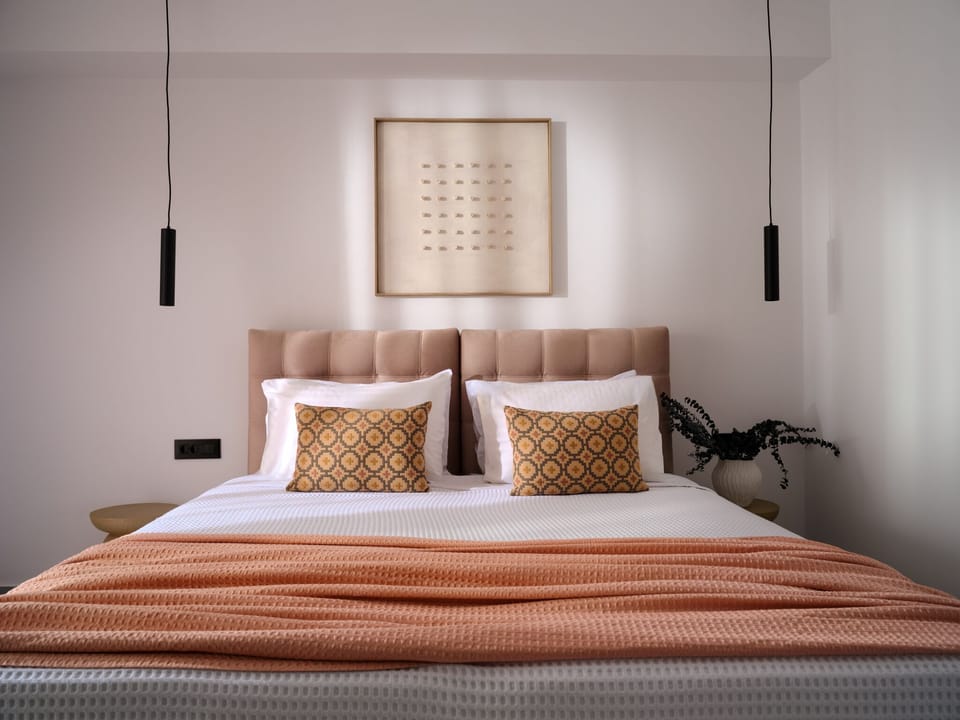 The ground-floor twin bedroom features an en-suite bathroom and opens directly t