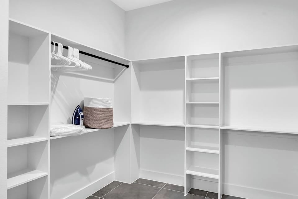 Ample storage with a full walk-in closet and hangers ready for extended stays.
