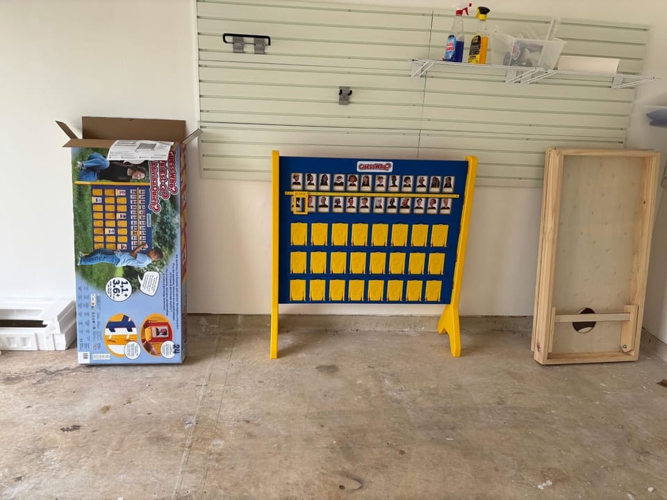 The fully fenced backyard is the centerpiece — fire up the propane BBQ grill, challenge your group to lifesize Guess Who, toss a round of cornhole, and settle in at the outdoor dining area under the covered patio with string lights.