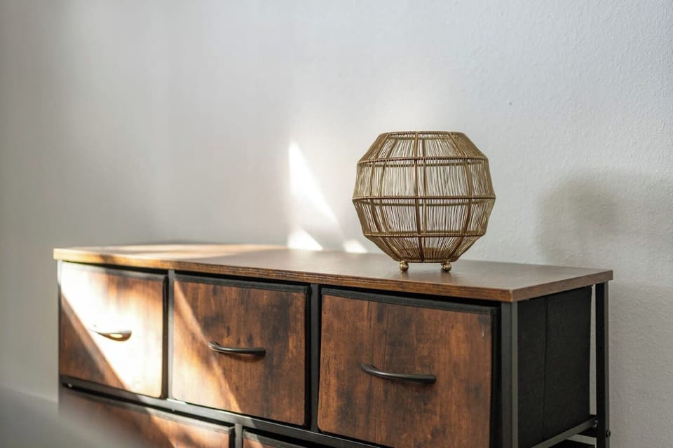 Thoughtfully styled dresser décor adds a clean, modern aesthetic to the bedroom, creating a cozy and polished atmosphere for your stay.