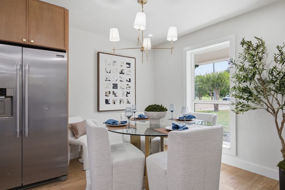 Vaulted Ceiling Kitchen with large island seating, pendant lighting, KitchenAid appliances, and plenty of prep space. Designed for cooking and gathering.