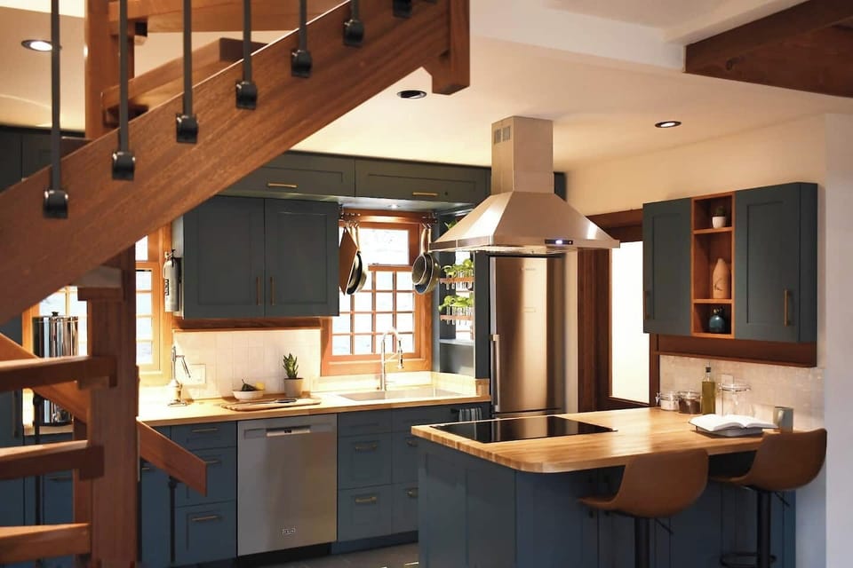 The kitchen is equipped with butcher block countertops, all new stainless steel appliances, oven, dishwasher, and induction cooktop. The peninsula makes it easy for you and yours to collaborate on culinary favorites+