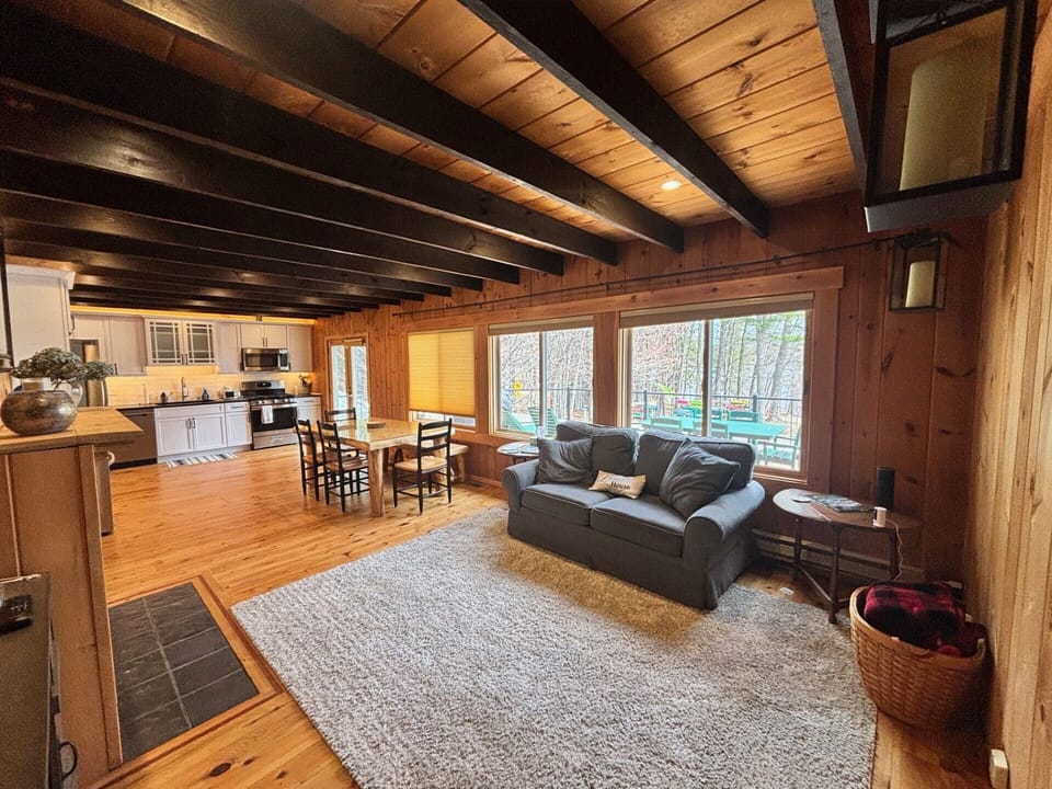 Open main living area, with doors onto the deck with amazing views