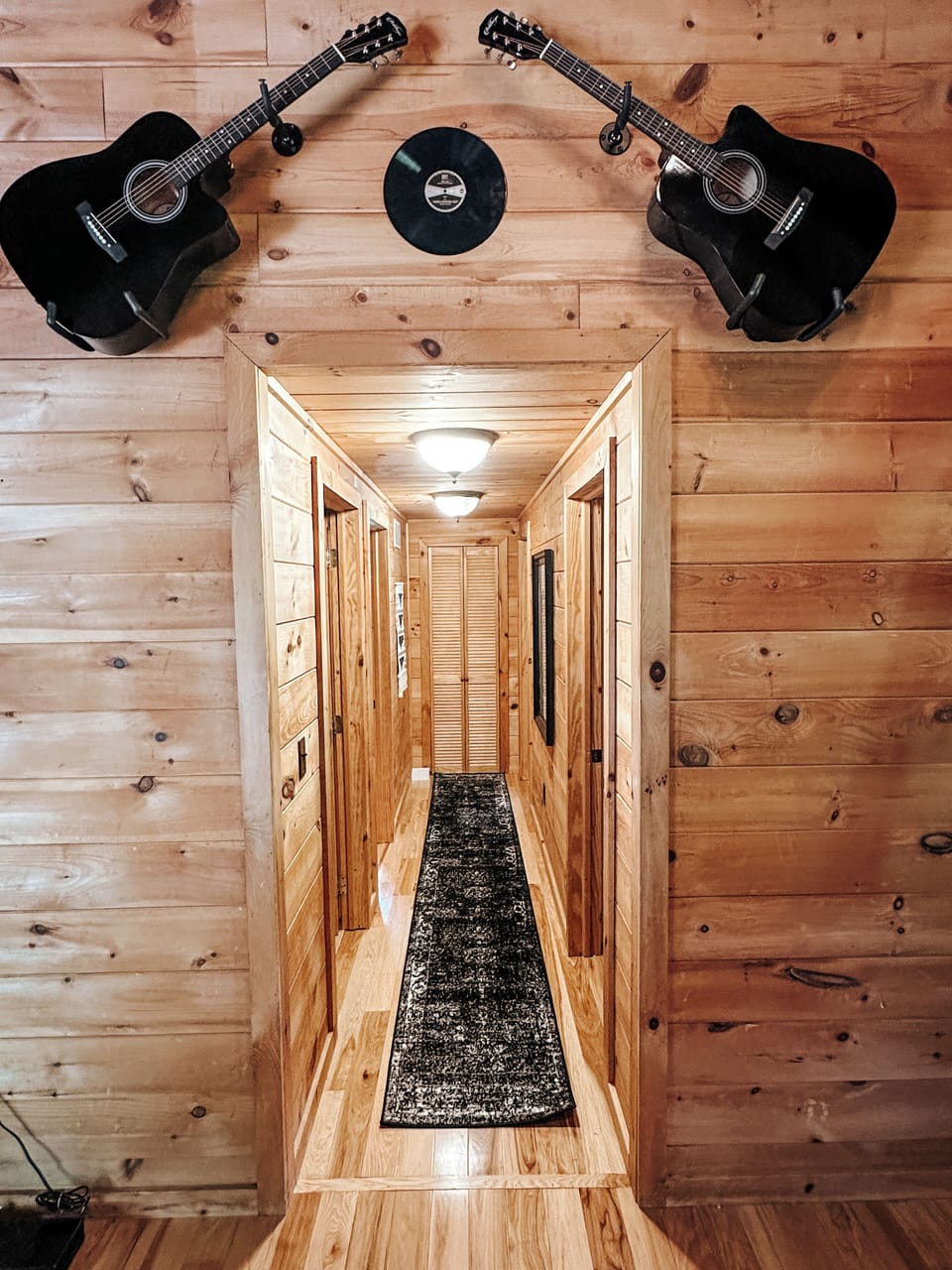 Hallway to BRs #2, #3, #4 and additional full bathroom. 