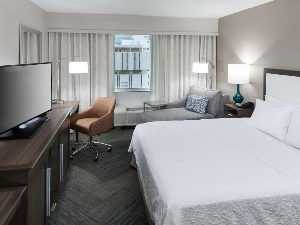 Stretch out and relax with a spacious, calming room setup.