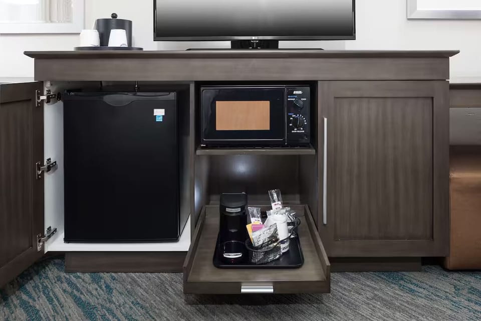 Recharge with easy snacks, coffee, and in-room essentials.