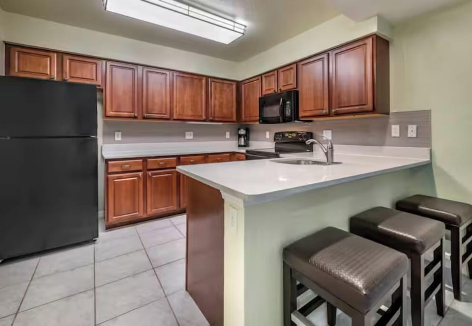 Cook with ease in a full kitchen with breakfast bar seating.