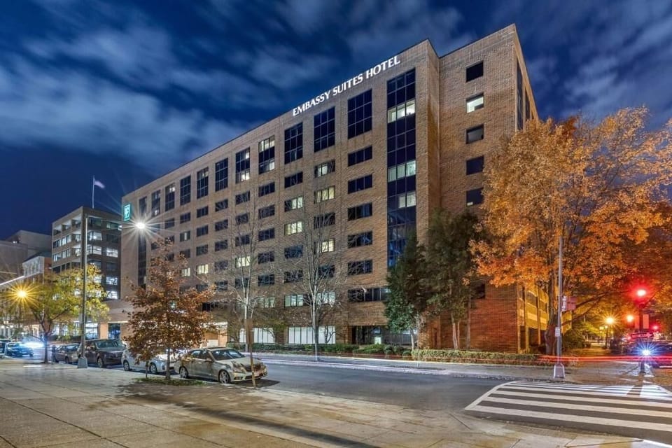 Come home to a well-lit hotel exterior at night.