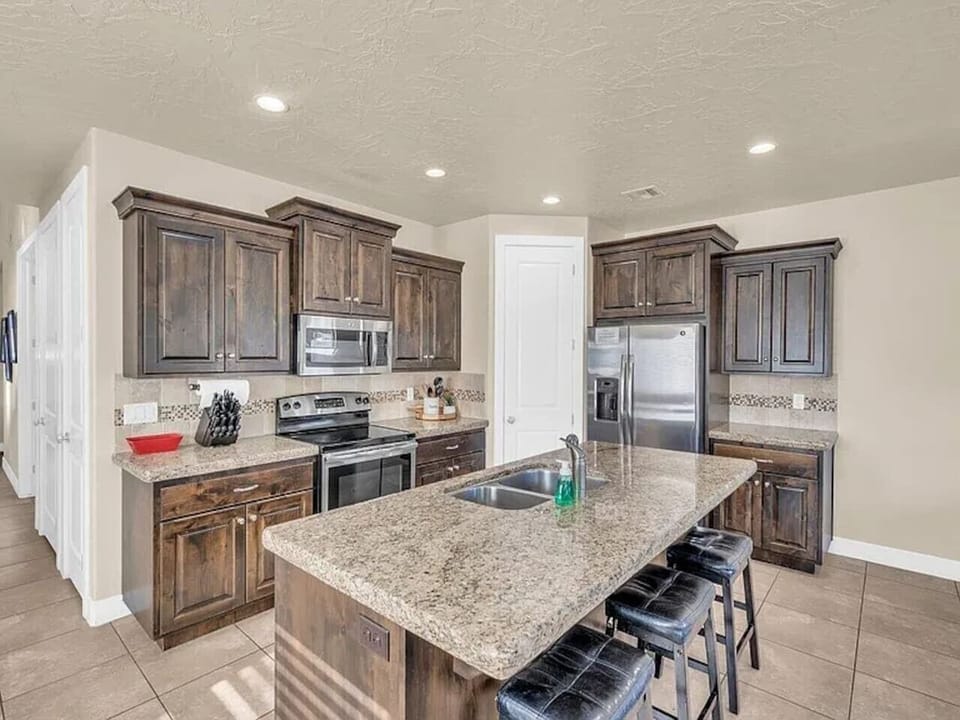 Spacious kitchen with island and modern appliances
