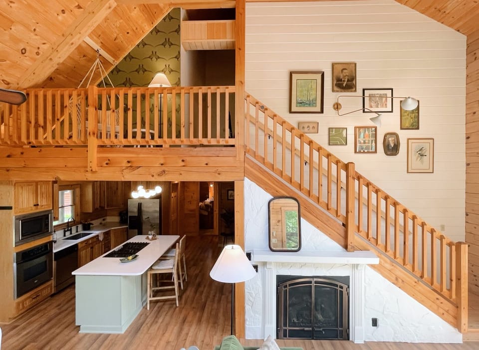 View of Kitchen, Fireplace, Stairs leading to upstairs bedroom 