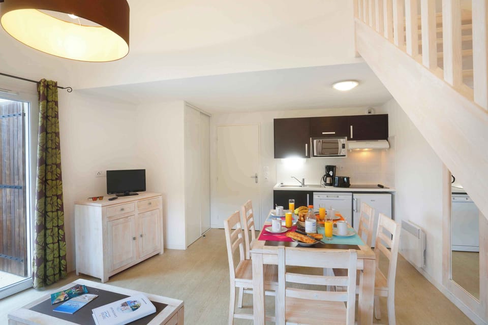 The open-plan kitchen and dining area offers plenty of space for large families to eat and relax together.