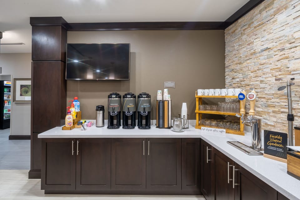Pour your perfect morning brew from a selection of fresh coffee and beverages, just steps from your suite.