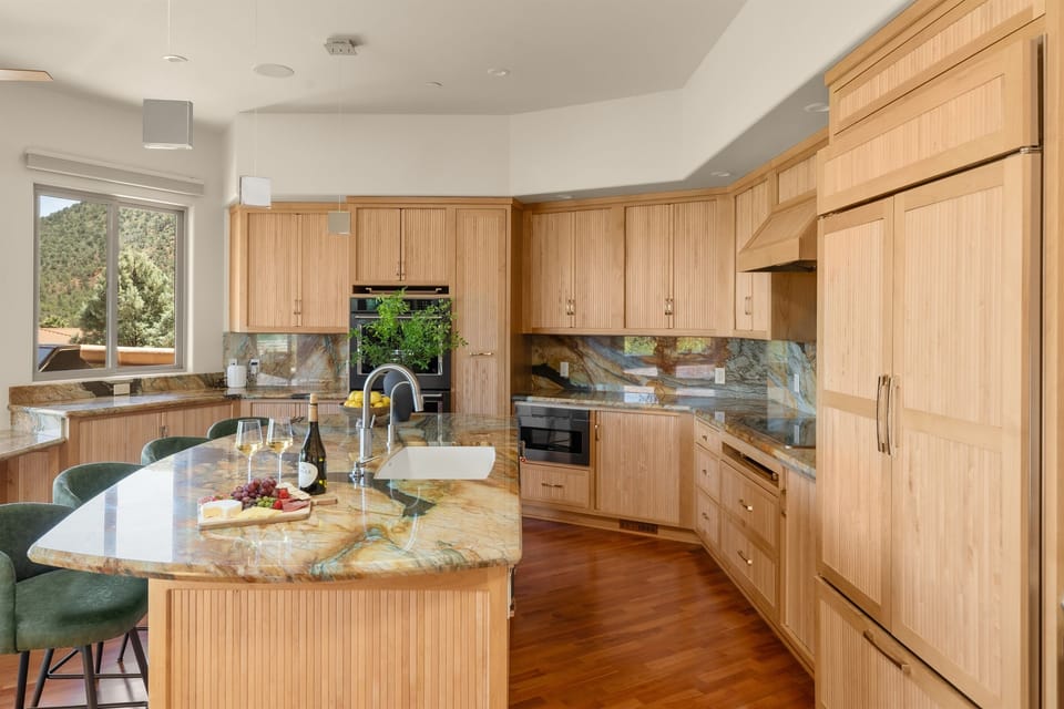 Cook and connect. The open-concept kitchen seamlessly integrates with the dining and living areas, allowing your whole group to stay engaged while preparing meals.