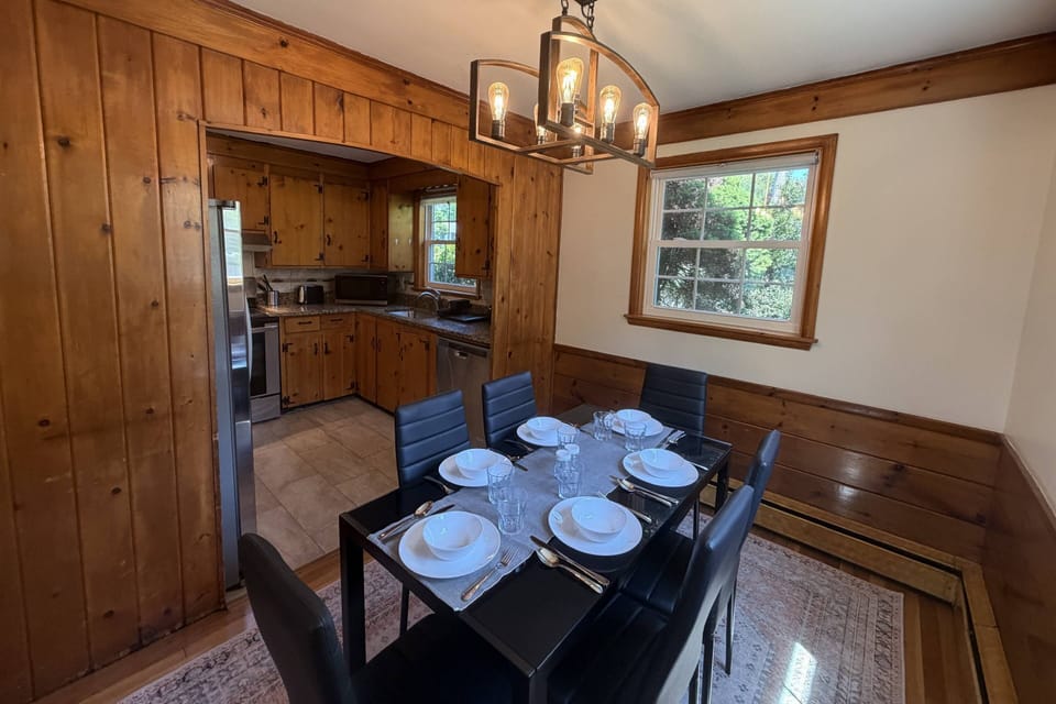 Dining area and view into fully equipped kitchen