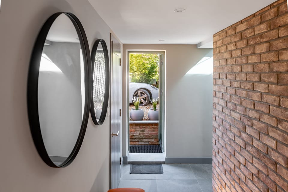 Enter into the property via the rear door adjacent to parking area
