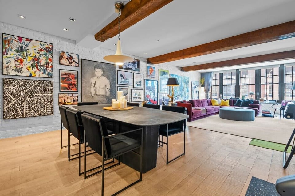 Dining and Living Area: Contemporary design featuring vibrant art and ample space for gatherings!