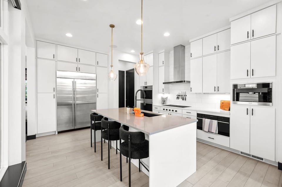 Whip up your favorite meals in this beautifully designed kitchen – includes breakfast bar seating for 3 and a Miele espresso maker.