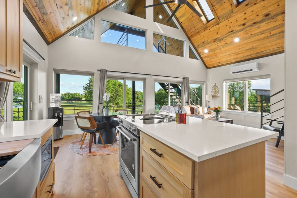 Big sky energy indoors with soaring ceilings and natural light.