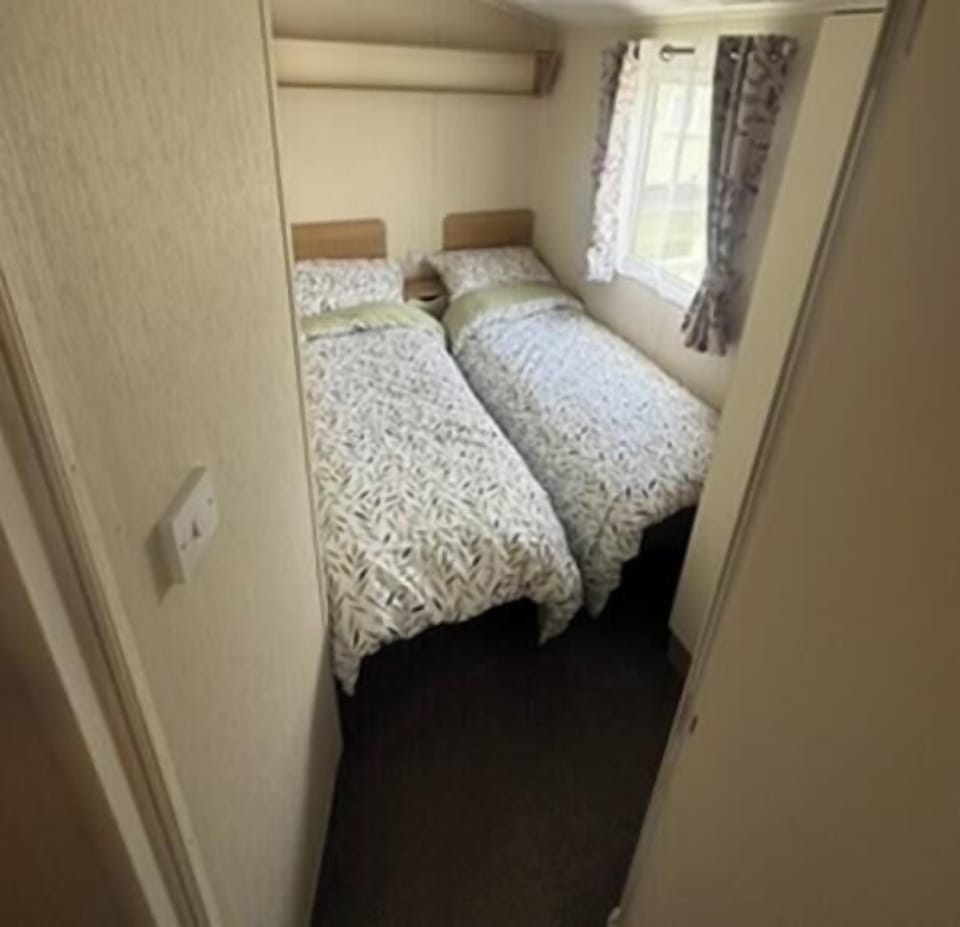 bedroom 2 
contains 2 single bed and wardrobe
