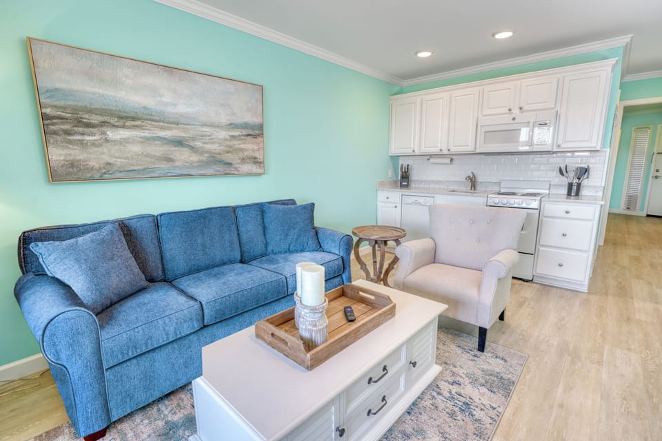Living room includes a QUEEN sleeper sofa with upgraded 5" memory foam mattress