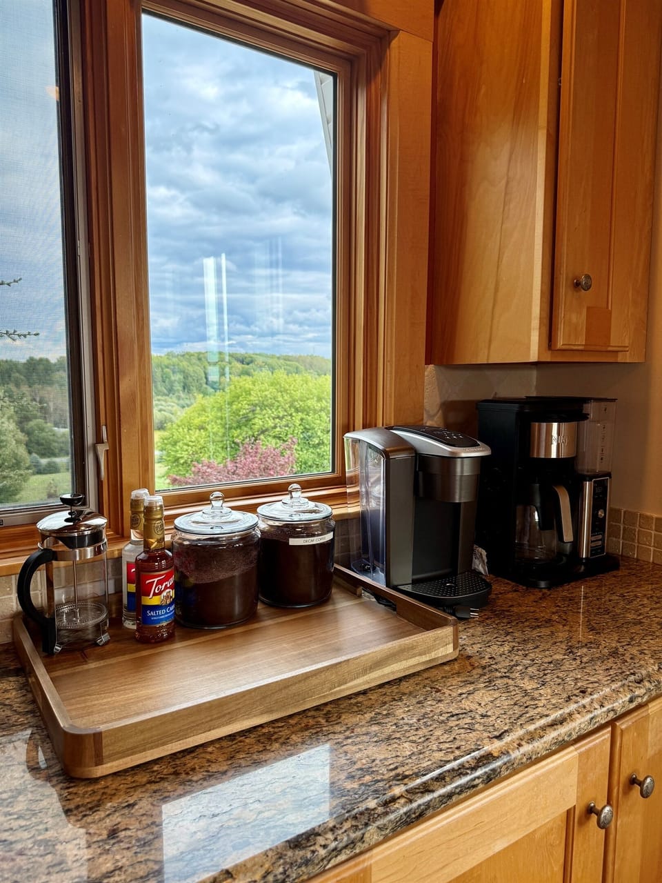 Start your morning with a cup of coffee or tea from the coffee bar. The coffee bar has a 12 cup coffee maker which also makes iced coffee, along with a Keurig coffee maker, and a French press. Plenty of syrups and flavorings are available.