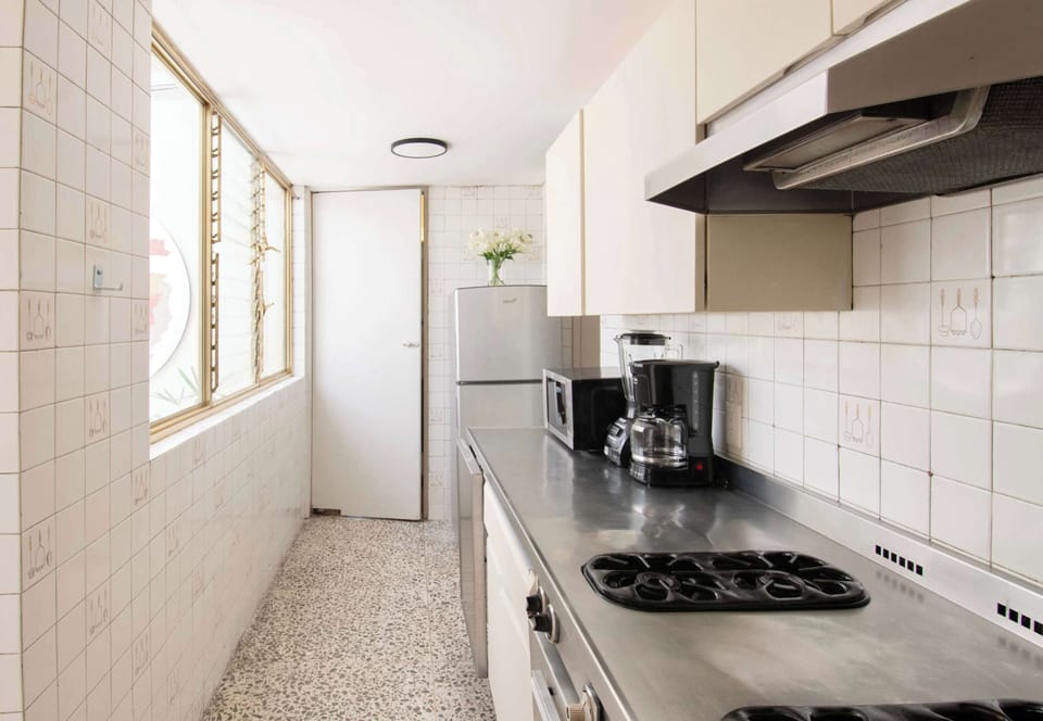 Natural light fills the kitchen throughout the day, creating a comfortable space to cook, unpack groceries, or enjoy a quiet morning before your adventures begin.