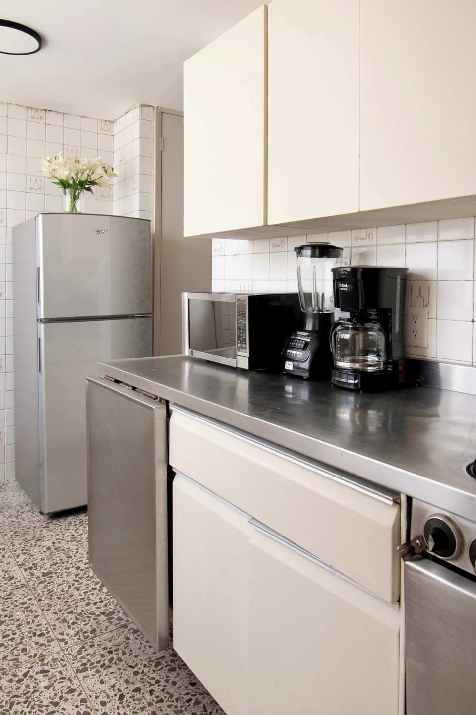 Equipped with everything needed for longer stays, including a full-size refrigerator, coffee maker, blender, microwave, cookware, and all the essentials to feel right at home.