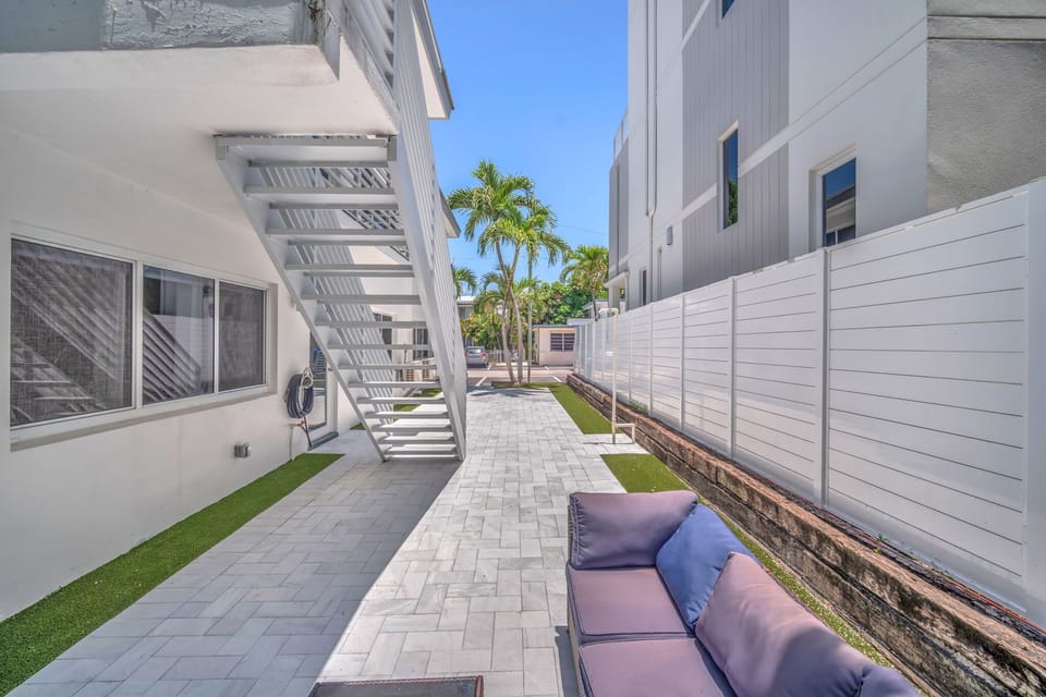 Shared backyard seating area featuring a cozy sectional sofa.