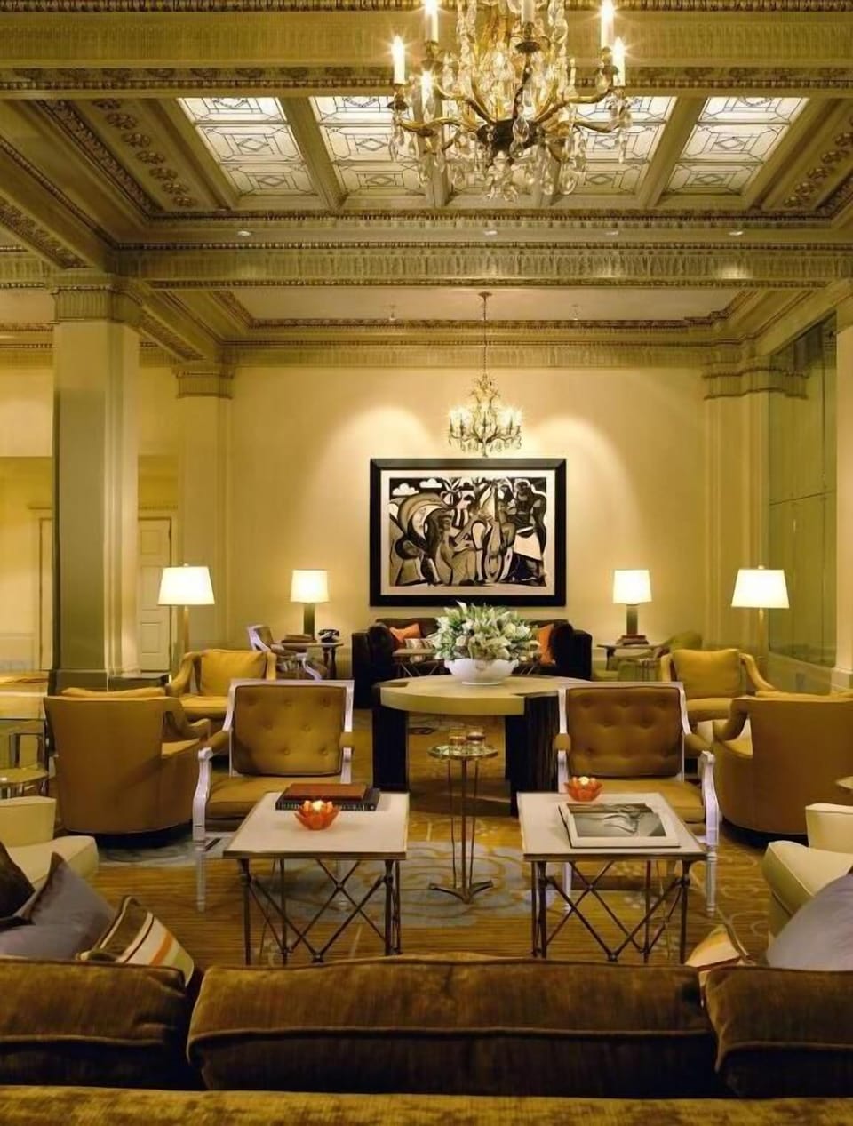 Settle into plush lounge seating beneath sparkling chandeliers.