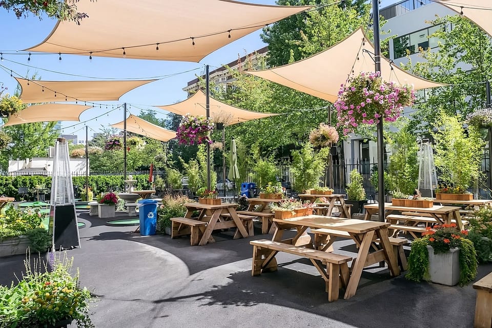 Unwind outdoors under sun sails with garden-fresh ambiance.