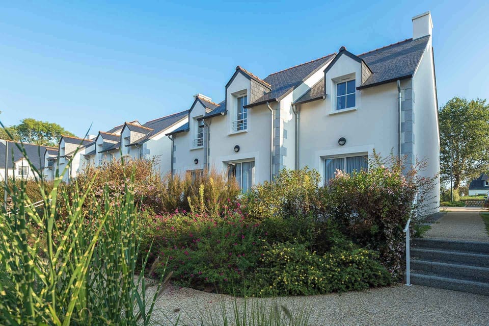 The exterior of the Breton semi-detached houses, set in the flowered grounds of the private park.